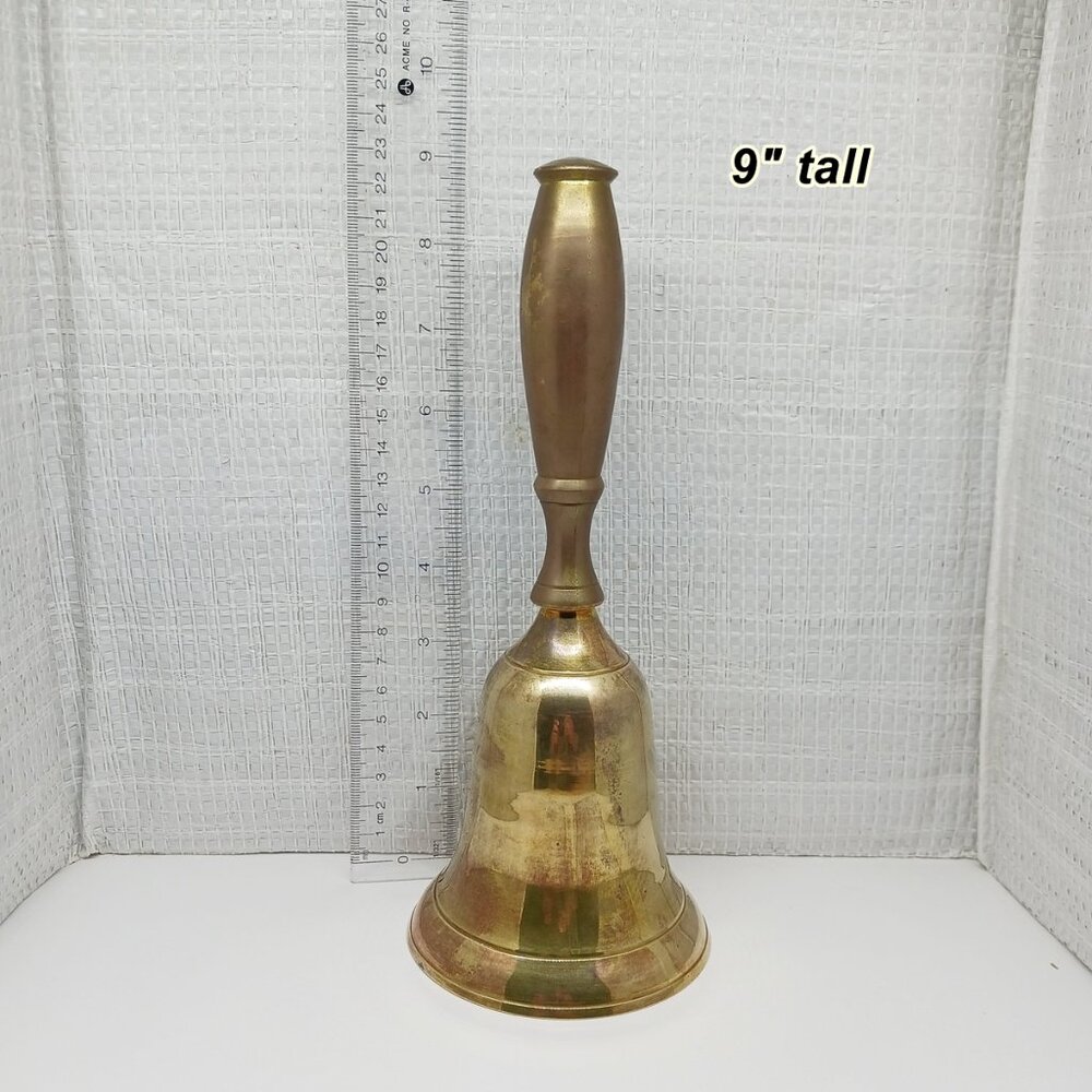 Brass bell 9" tall. Looks like a school bell and I think the handle is metal?